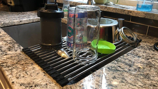 If you don’t have a ton of space in your kitchen, Ahyuan’s Roll up Dish Drying Rack packs down to the size of a rolling pin when not in use,and extends across a side of your sink when you need it.